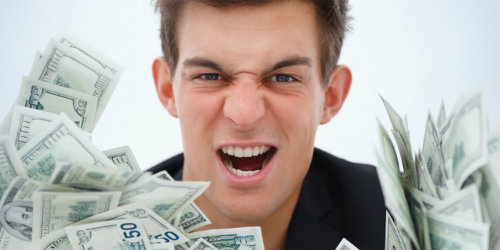 closeup of a young business man holding money Zabranjeno za starije od 29